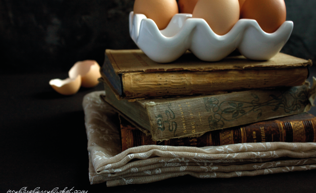 photo of eggs on a pile of books